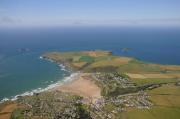 Pentire Head with Polzeath beach in foreground.