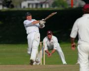 Gorran's Dan Laming hits a 6 off the bowling of Dave Dunnett.