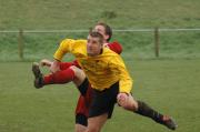 Bodmins' Luke Hodge wins the aerial battle with Paul Waters.