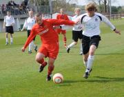 Wadebridge forward Chris Wolstencroft fends off a tackle from Penzance centre half James Street.