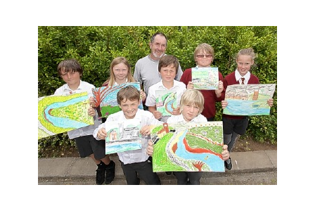  Wadebridge CP School pupils Jack, Lucy, Fergal,  Ewan, Isaac, Bryn and Hannah, with Adrian Langdon, show off their pictures.